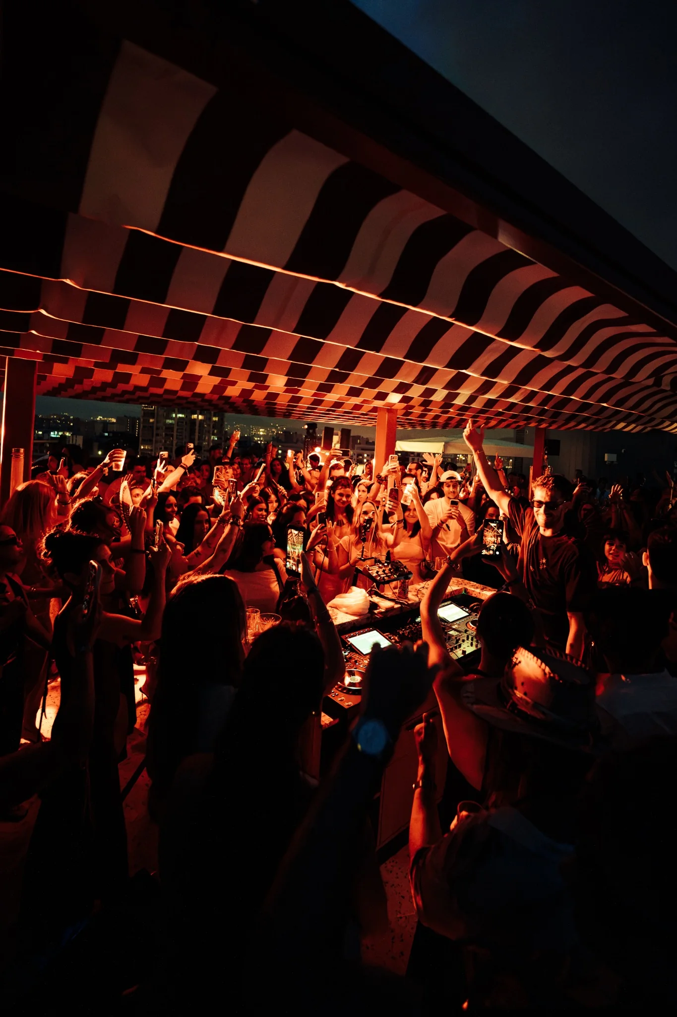 NOTJUST performing for a rooftop crowd